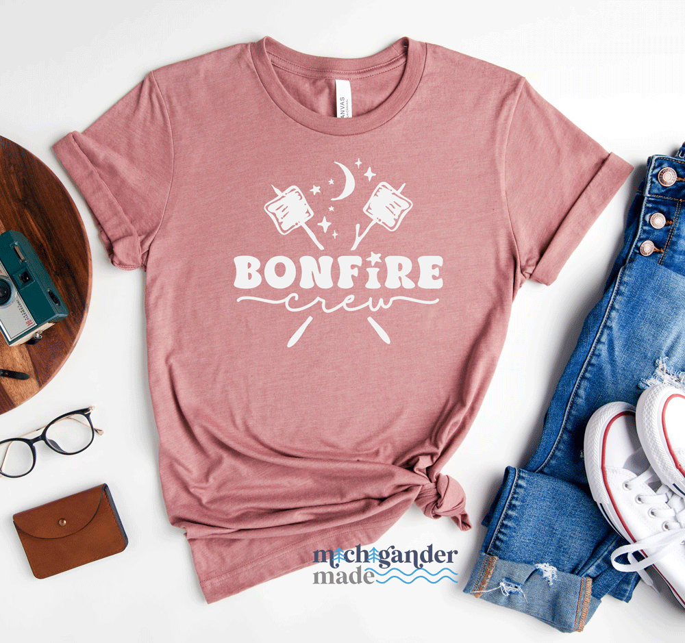 A Bella and Canvas tshirt in heather mauve with Michigander Made Bonfire design