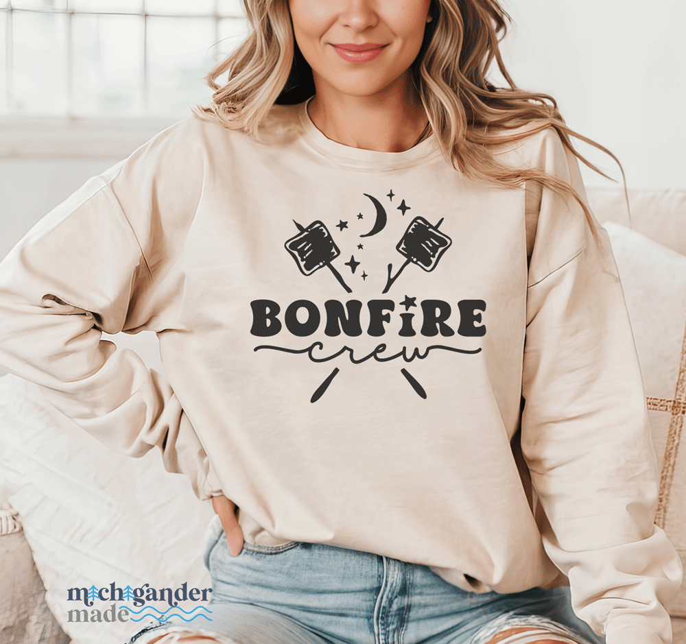 A crewneck sweatshirt in sand color with Michigander Made Bonfire design