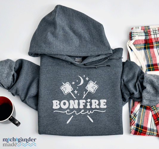 A hooded sweatshirt in dark heather with Michigander Made Bonfire design